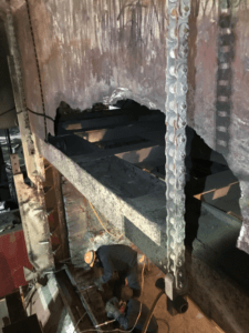 A broken aluminum reverb furnace, repaired by Schad Refractory services