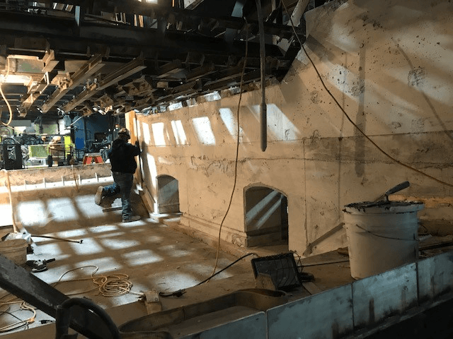 Schad Refractory contractors work on an aluminum reverb furnace.
